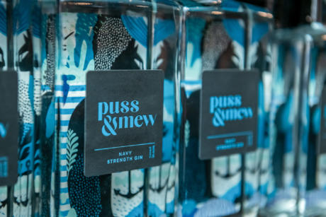 Puss & Mew labelled Gin with clear bottle blue and black product labelling