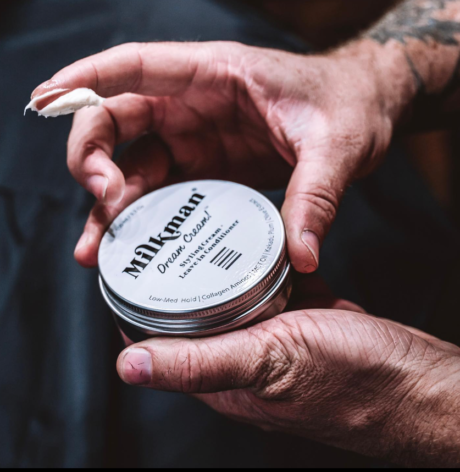 Milkman Grooming Co Product Label on Tin in Hands