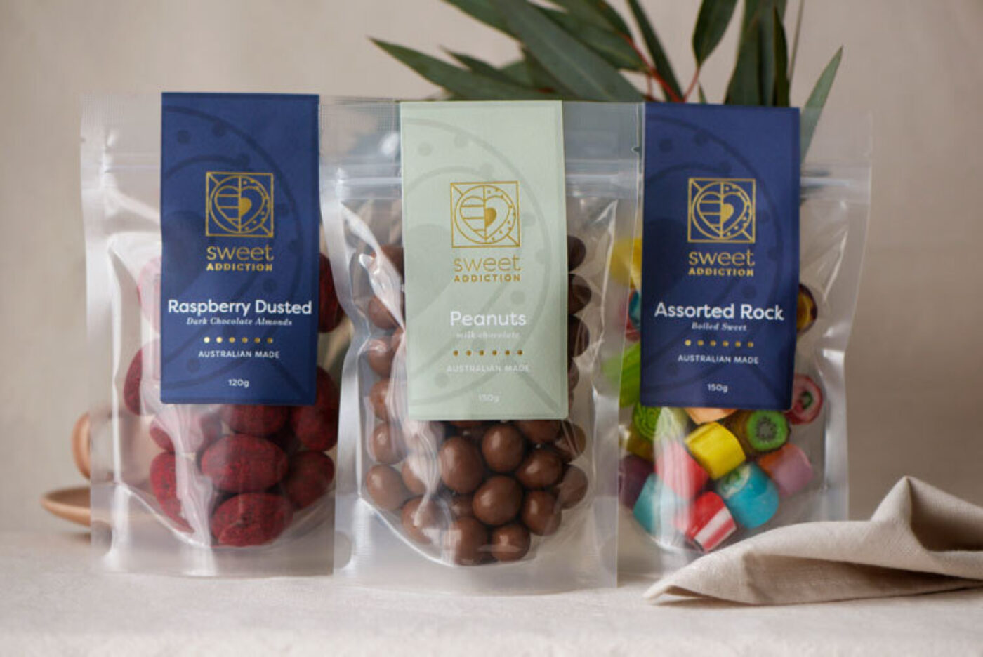 Product labels on clear stand up pouches branded Sweet Addiction.